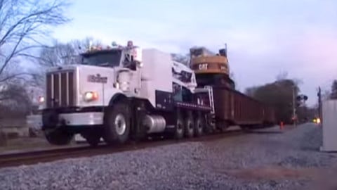 Diesel Truck Pulling Train On The Tracks | Train Fanatics Videos