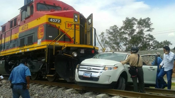 Train Wrecks Car As Driver Races Across Tracks! | Train Fanatics Videos