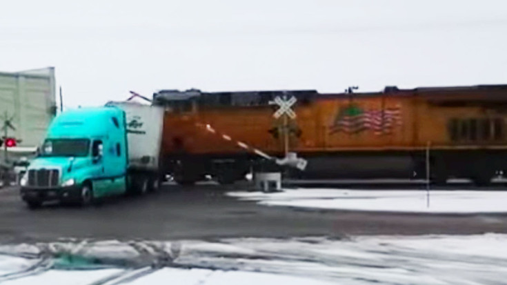 Semi Stuck On Track Is Sliced In Half By UP Freight! | Train Fanatics Videos
