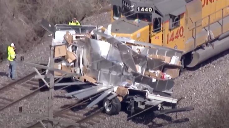 Fed Ex Truck Becomes Hood Ornament | Train Fanatics Videos